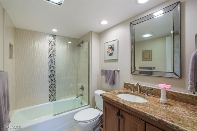 full bathroom with shower / bath combination with glass door, vanity, and toilet