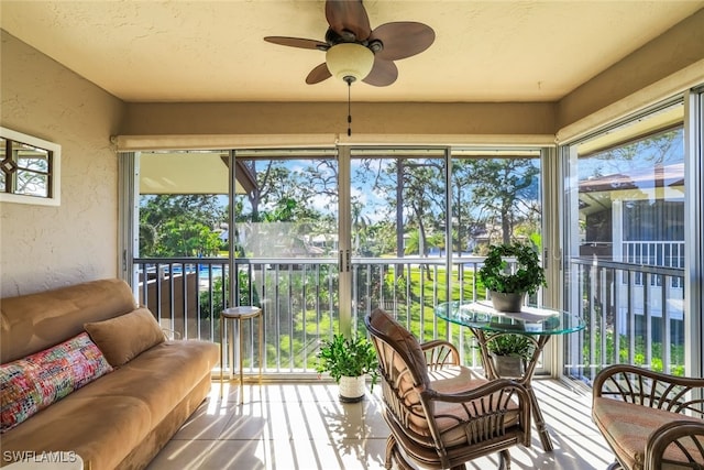 sunroom / solarium with ceiling fan