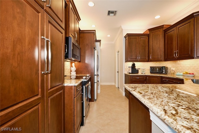 kitchen with stainless steel appliances, crown molding, light stone countertops, and decorative backsplash