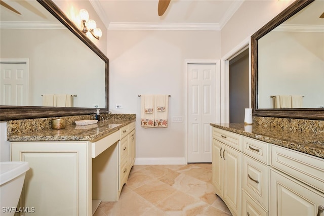 bathroom with ornamental molding, vanity, and ceiling fan