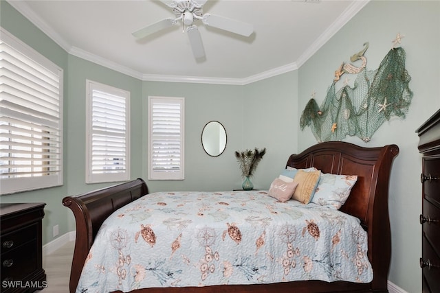 bedroom with hardwood / wood-style flooring, ornamental molding, and ceiling fan