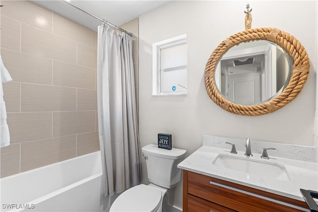 full bathroom with shower / tub combo with curtain, vanity, and toilet