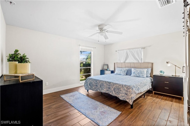 bedroom with wood-type flooring and ceiling fan