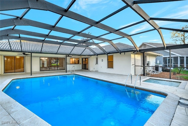 view of pool featuring a lanai, a patio, and ceiling fan