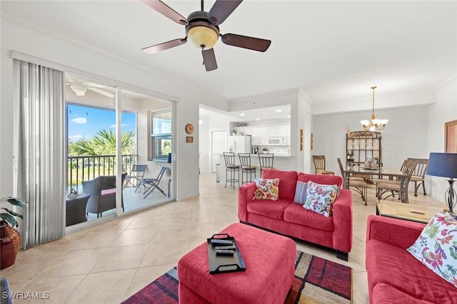 living room with light tile patterned flooring, crown molding, and ceiling fan with notable chandelier