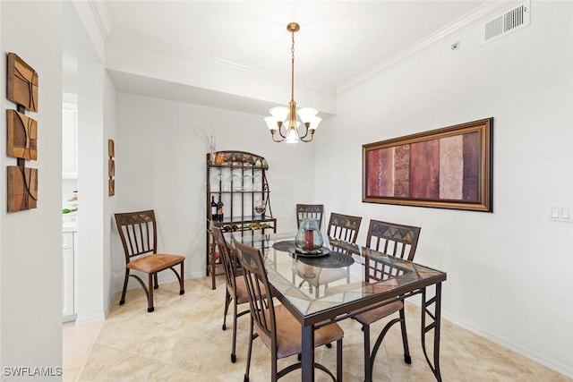 dining space with crown molding and a notable chandelier