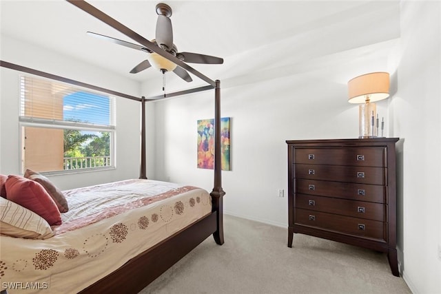 bedroom featuring ceiling fan and light carpet