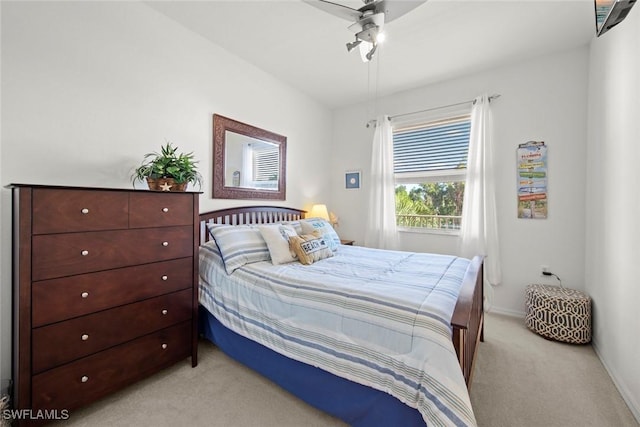 bedroom featuring light carpet and ceiling fan