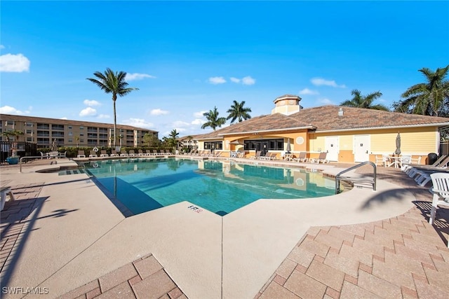 view of swimming pool with a patio area