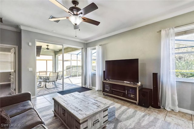 tiled living room featuring crown molding, a wealth of natural light, and ceiling fan