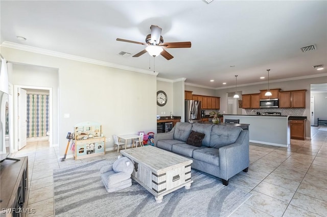 living room with crown molding, ceiling fan, and light tile patterned flooring