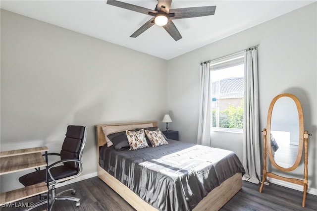 bedroom with ceiling fan and dark hardwood / wood-style flooring