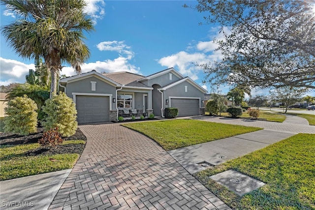 ranch-style house with a garage and a front yard