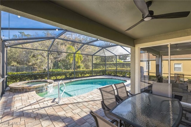 view of swimming pool with an in ground hot tub, a lanai, and a patio area