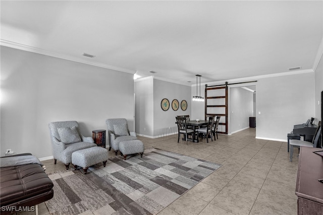 sitting room with crown molding, a barn door, and light tile patterned floors