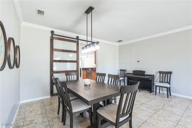 tiled dining area with ornamental molding and a barn door