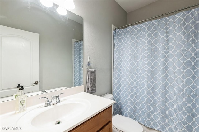 bathroom with vanity and toilet