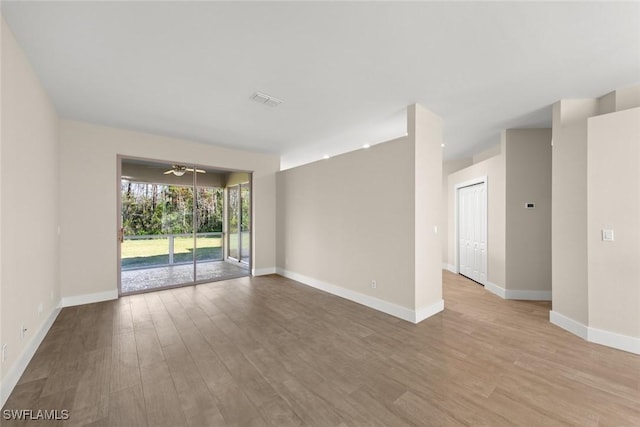 spare room featuring light wood-type flooring