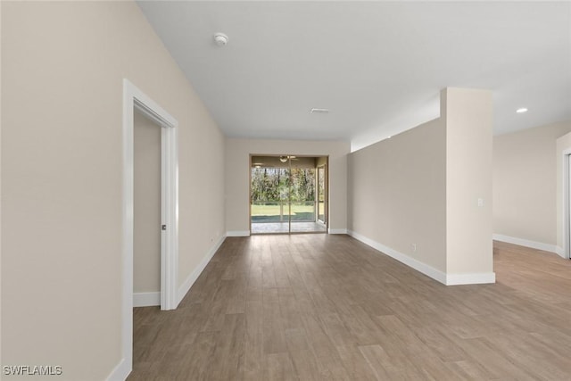 unfurnished room with light hardwood / wood-style flooring