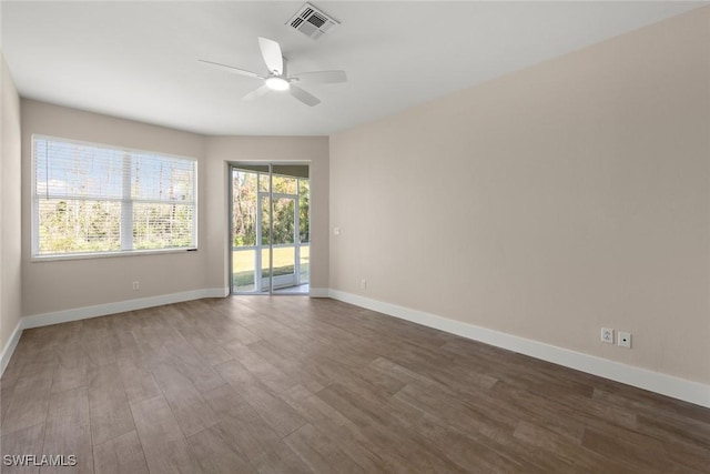 empty room featuring hardwood / wood-style floors and ceiling fan