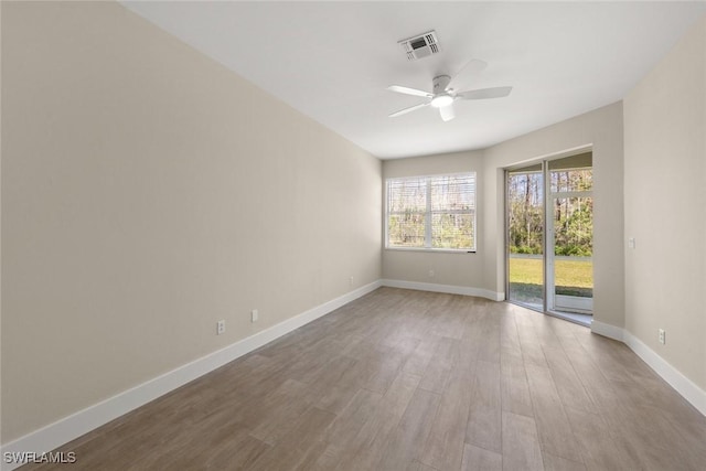 empty room featuring wood-type flooring and ceiling fan