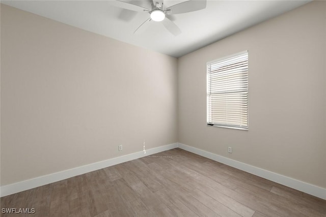 spare room with light hardwood / wood-style floors and ceiling fan