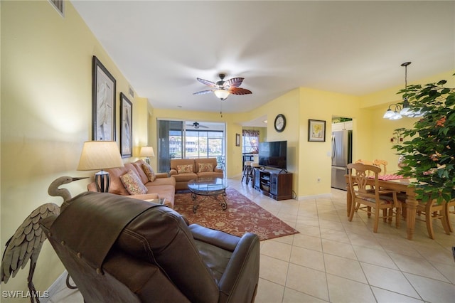 tiled living room with ceiling fan