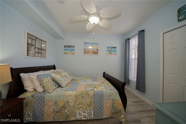 bedroom with wood-type flooring and ceiling fan