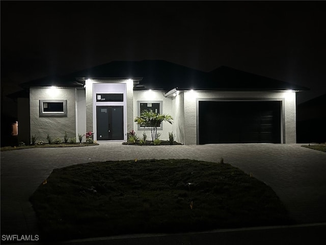 view of front of property with a garage