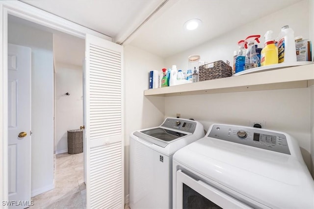 washroom featuring independent washer and dryer