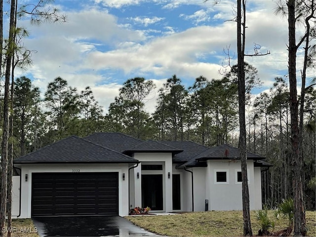 prairie-style home featuring a garage