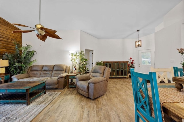 living room with a ceiling fan and light wood-style floors