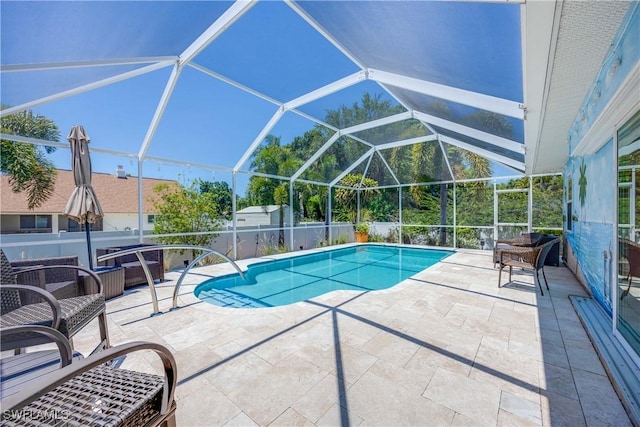 view of pool with a lanai, a fenced in pool, a patio, and fence