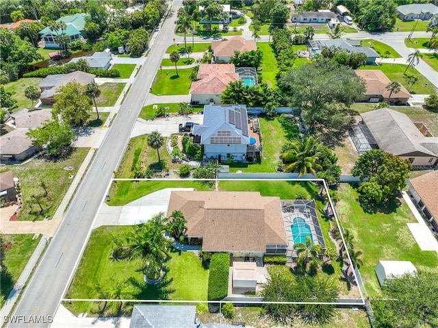 birds eye view of property with a residential view