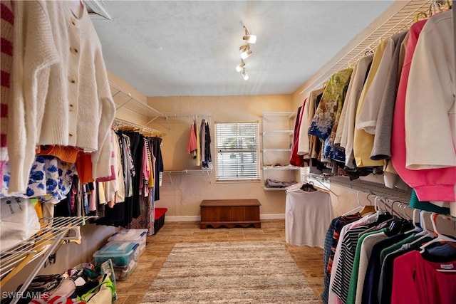 spacious closet with wood finished floors