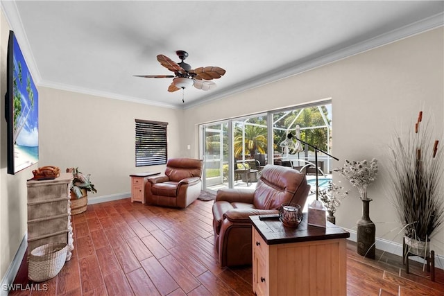 sitting room with ceiling fan, baseboards, dark wood-style floors, and ornamental molding