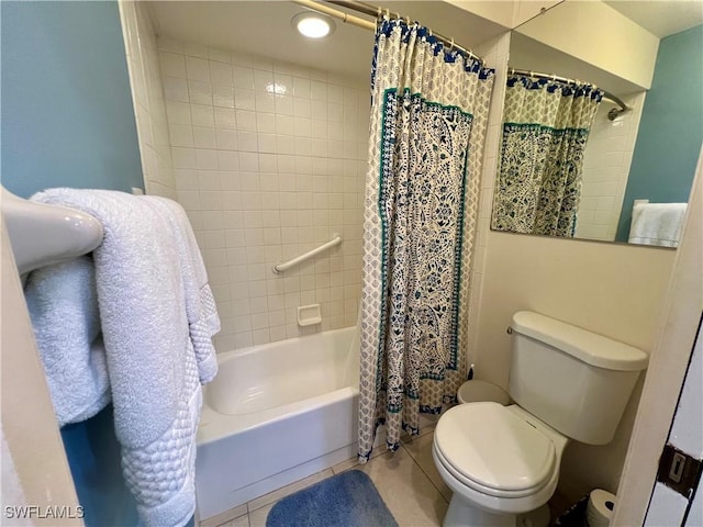 bathroom with toilet, tile patterned flooring, and shower / tub combo