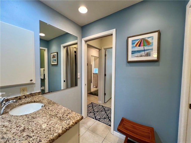 bathroom with vanity and tile patterned flooring