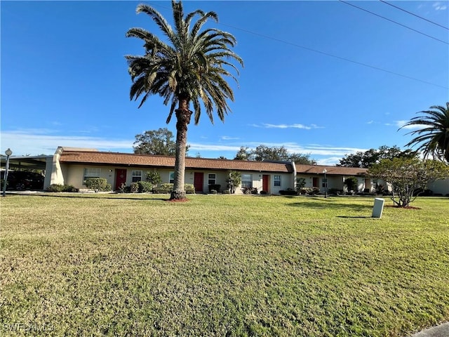 ranch-style home with a front yard