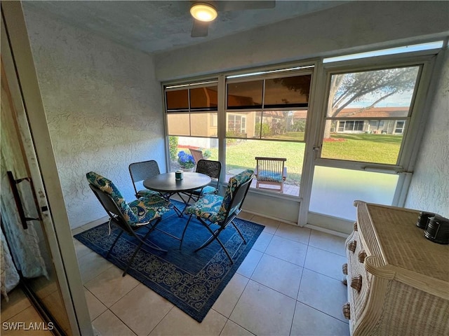 sunroom featuring ceiling fan