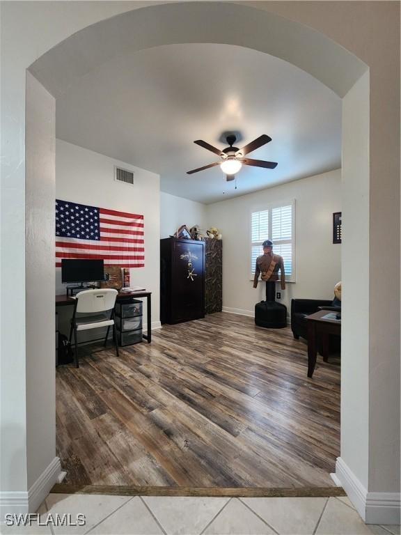 interior space with hardwood / wood-style flooring and ceiling fan