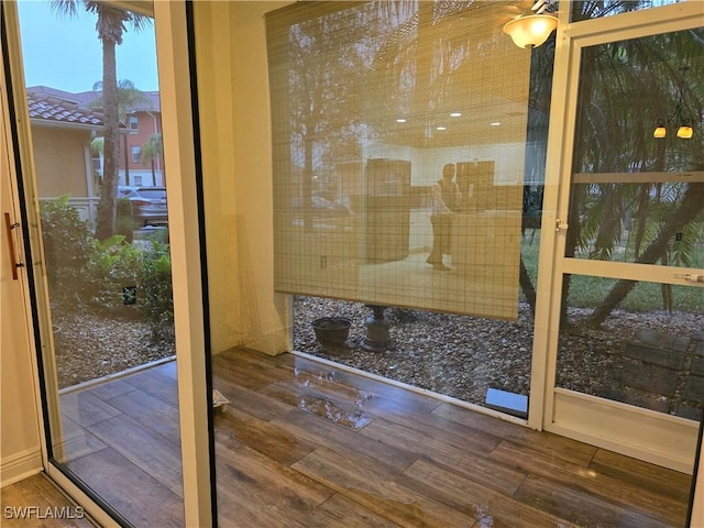 doorway to outside with hardwood / wood-style flooring