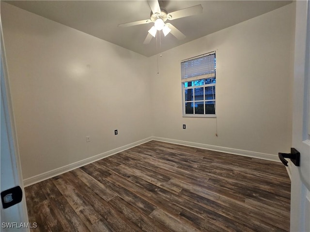 spare room featuring ceiling fan and dark hardwood / wood-style floors