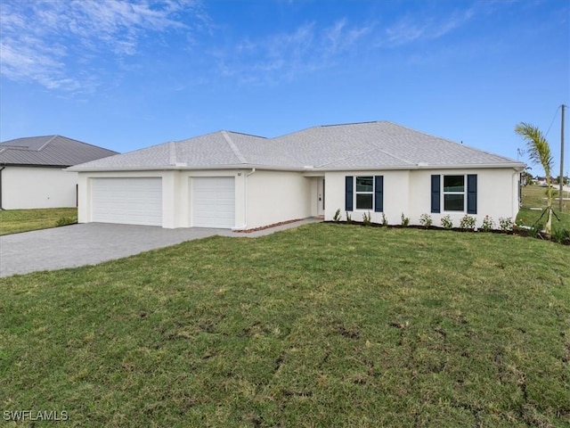 view of front of property with a garage and a front yard