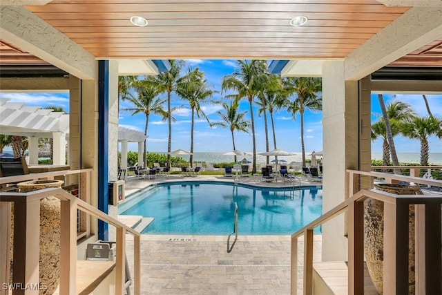 view of swimming pool with a pergola and a patio area