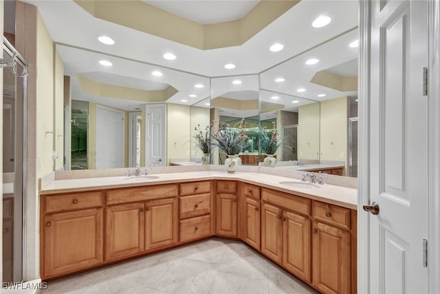 bathroom with vanity and tile patterned flooring