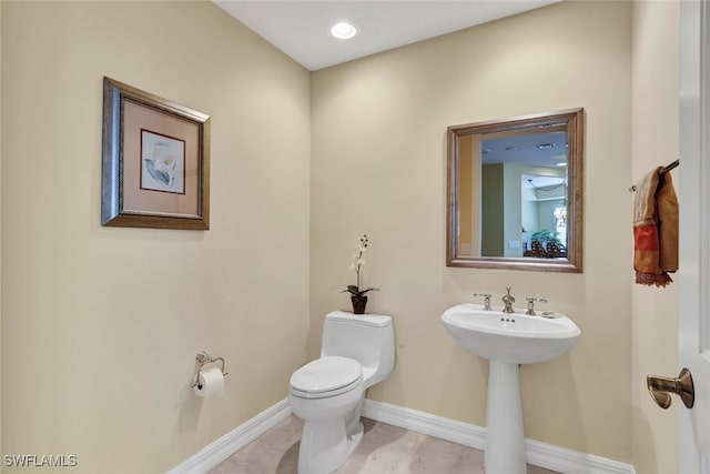 bathroom featuring toilet and sink