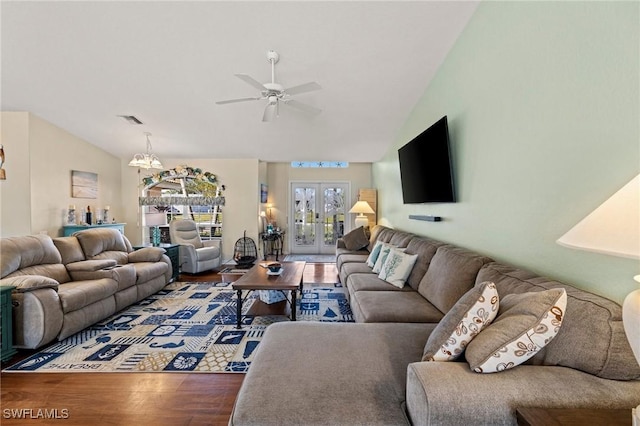 living room featuring wood-type flooring, lofted ceiling, ceiling fan, and french doors