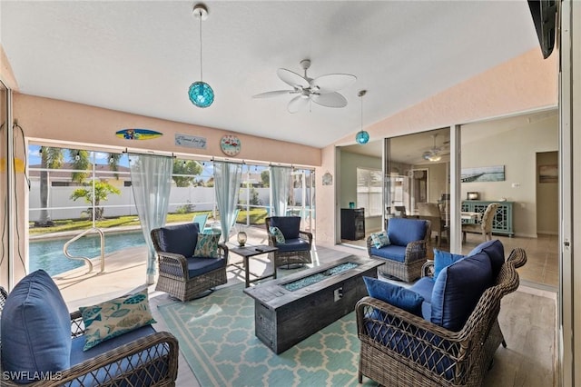 interior space with ceiling fan, vaulted ceiling, and hardwood / wood-style floors