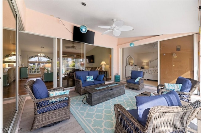 view of patio / terrace with an outdoor living space with a fire pit